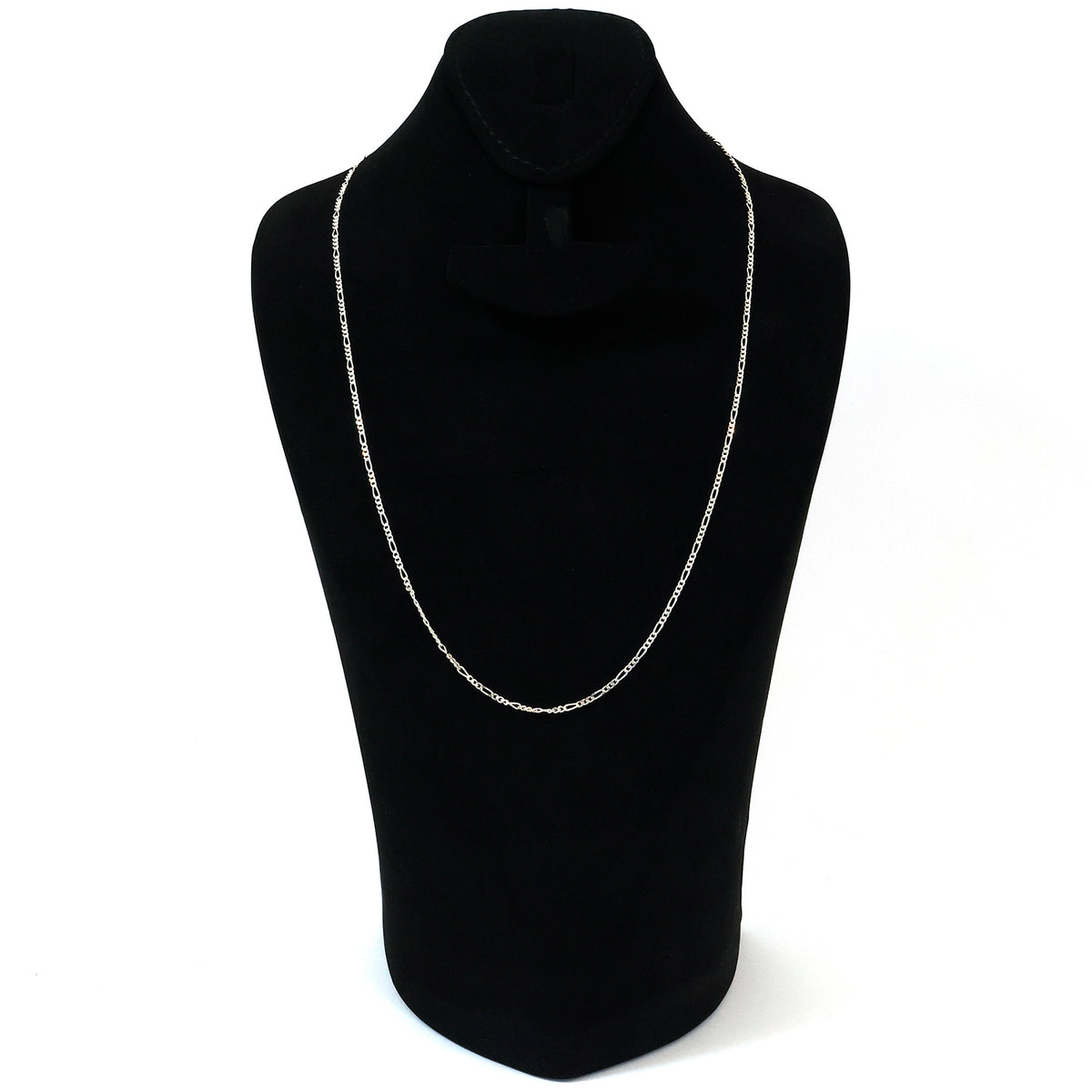Silver necklace on a black mannequin bust against a white background
