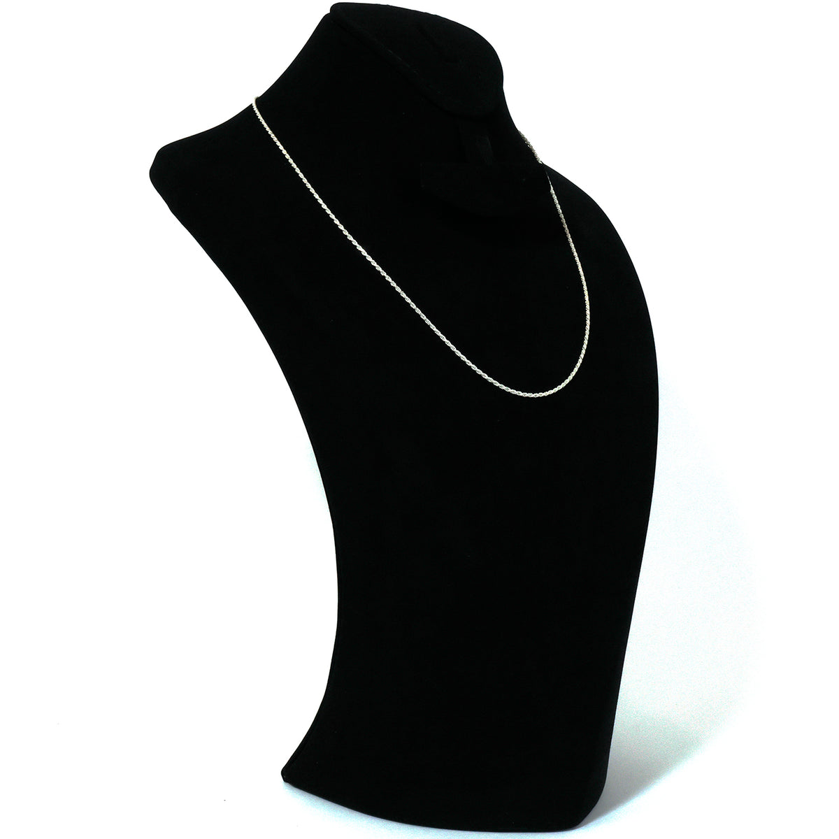 Gold necklace with a heart-shaped pendant on a black mannequin bust.