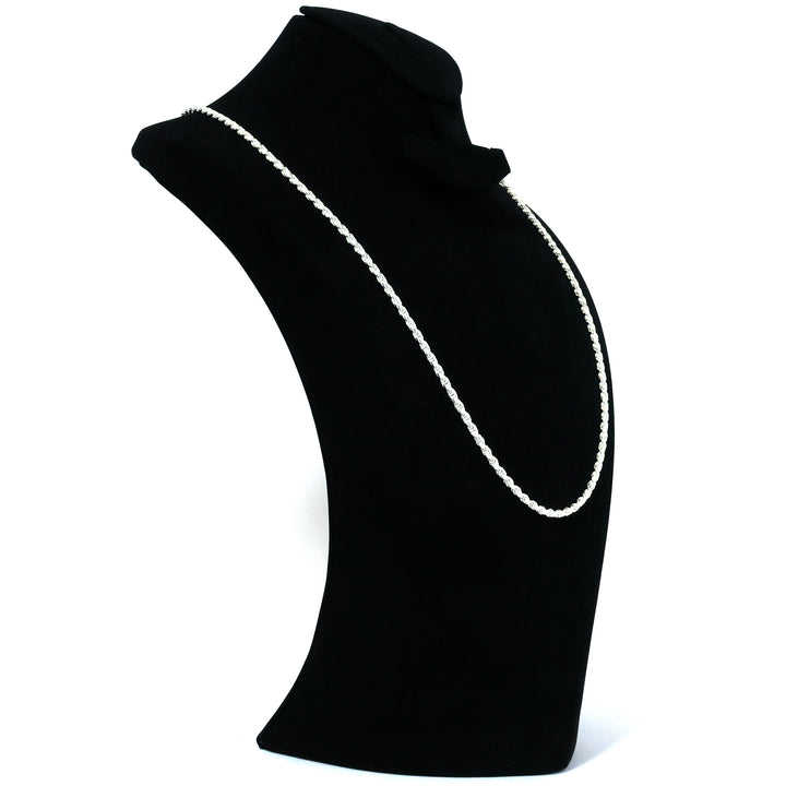 Black turtleneck sweater with white trim on a white background
