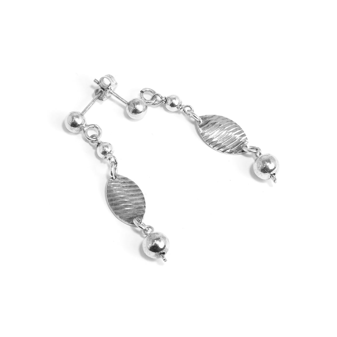 Silver bracelet with various shaped beads on a white background