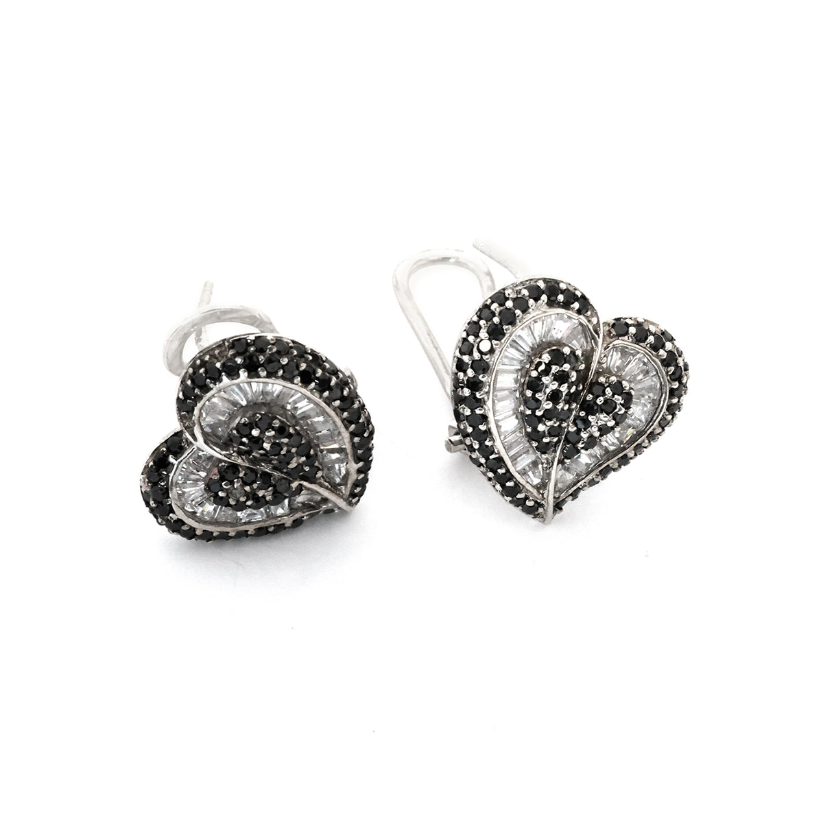 Heart-shaped earrings with black and clear gemstones on a white background