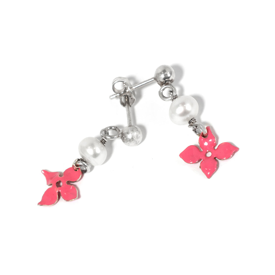 Pair of earrings with pink butterfly charms on a white background