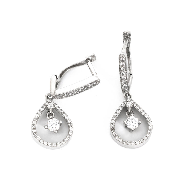 Pair of silver teardrop earrings with clear gemstones on a white background