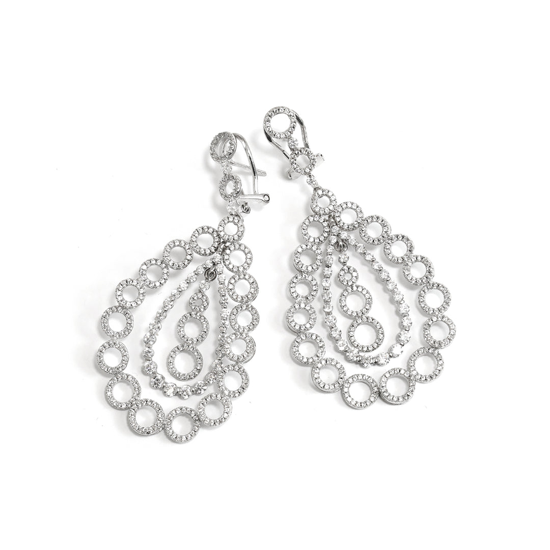 Pair من فضة أقراط on white background