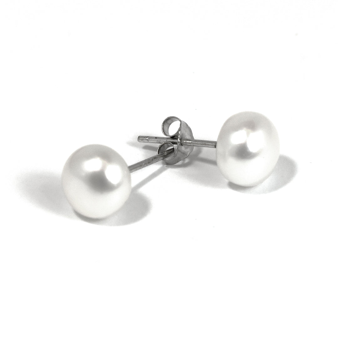 Pair of pearl earrings on a white background