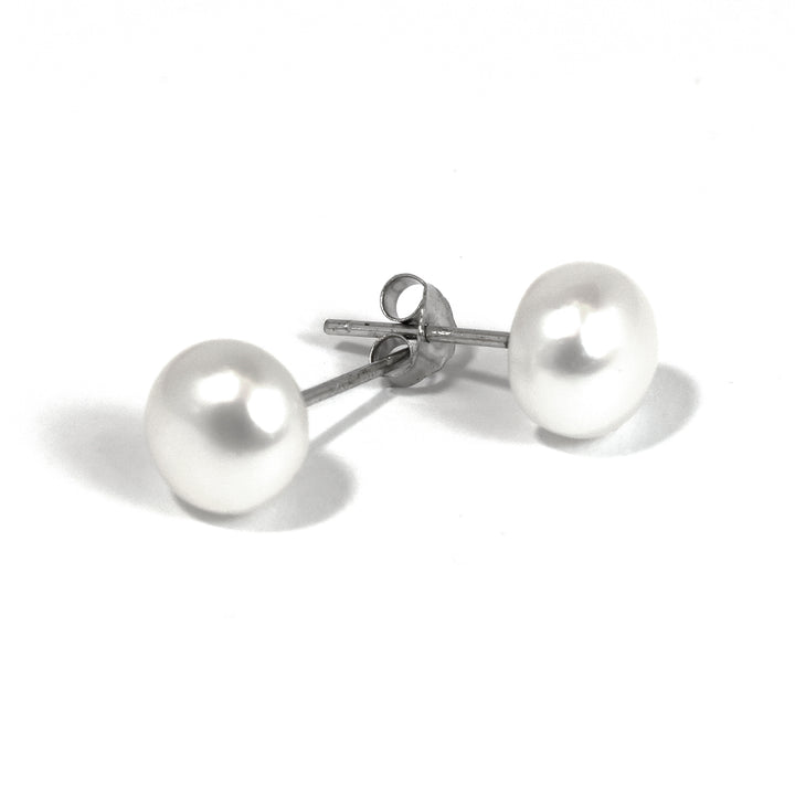 Pair of pearl earrings on a white background