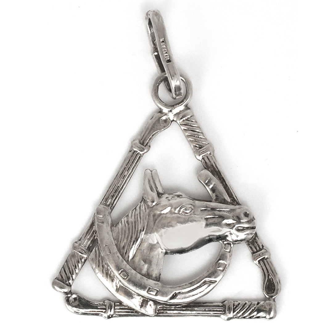 Silver pendant with horse design on a white background
