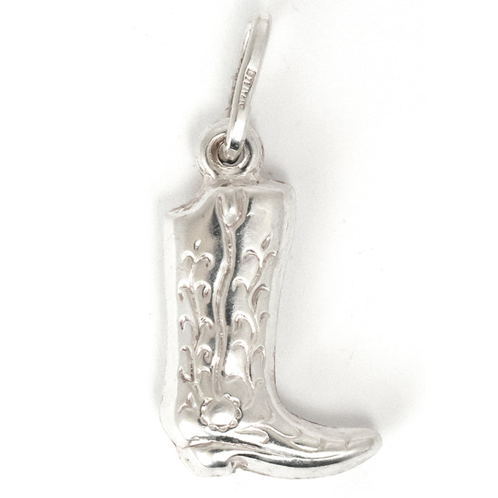 Silver cowboy boot pendant on a white background