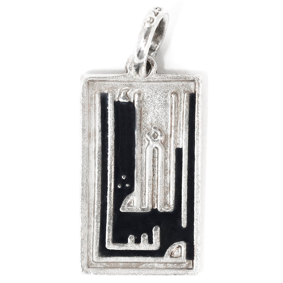Silver pendant with black inlay on a white background
