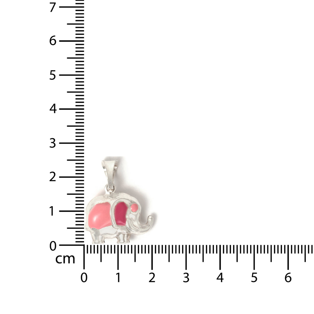 Silver elephant pendant with pink interior on a ruler for scale