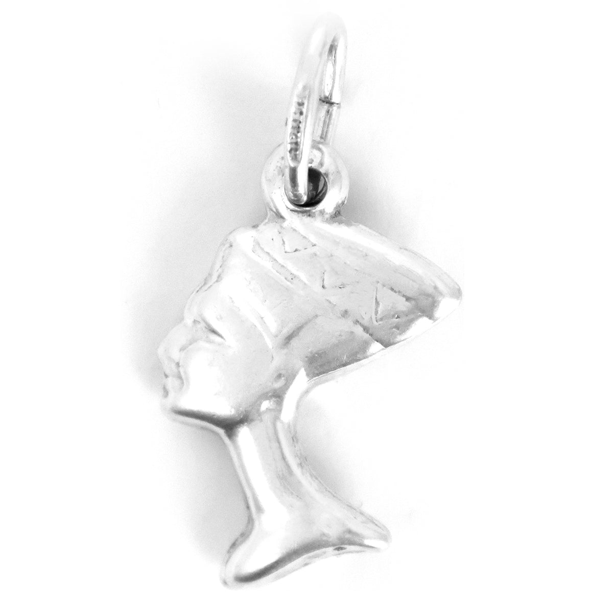 Silver pendant of a profiled face on a white background