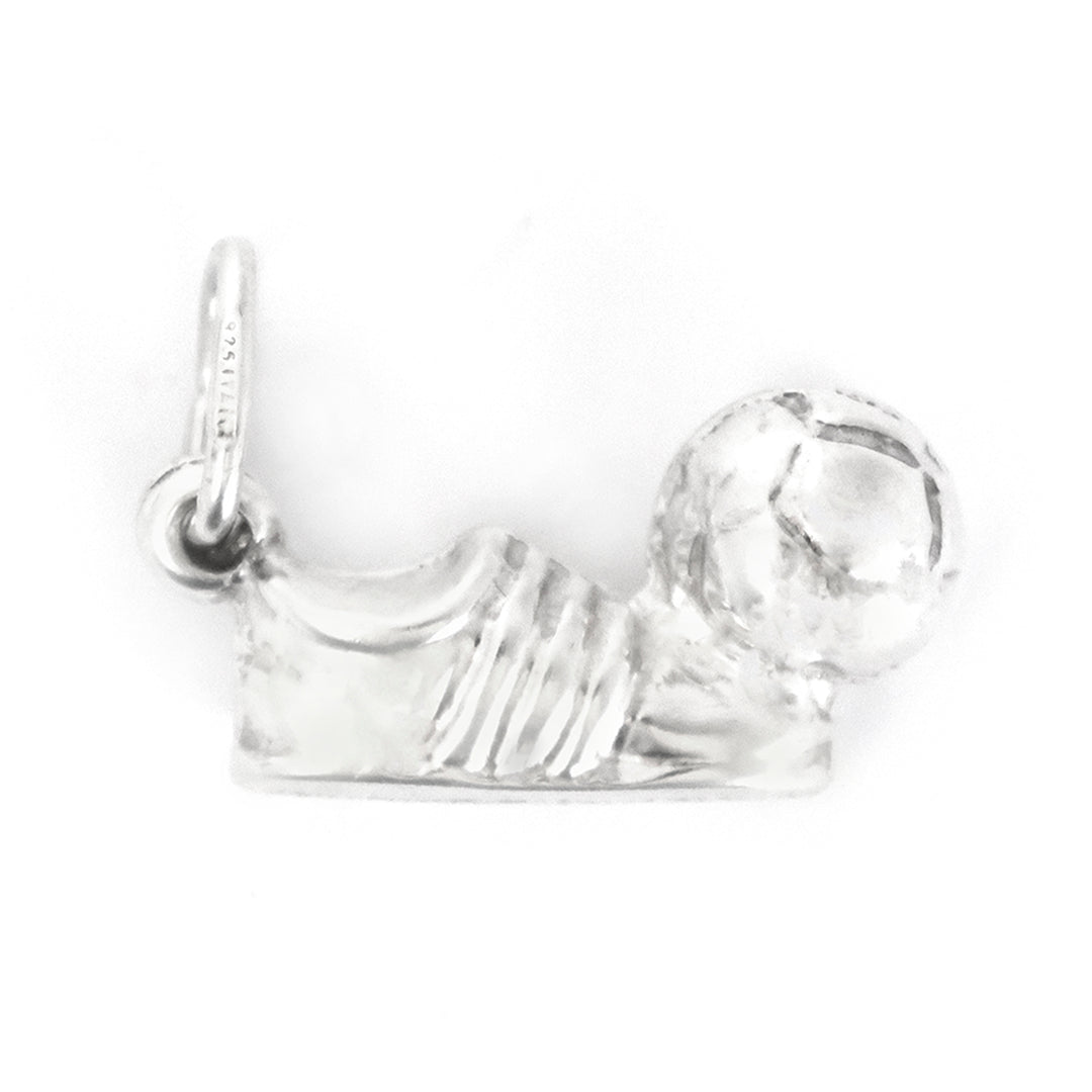 Silver shoe charm on a white background