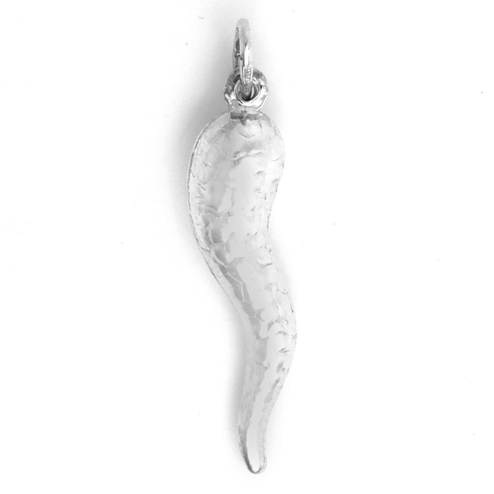 Silver horn-shaped pendant on a white background
