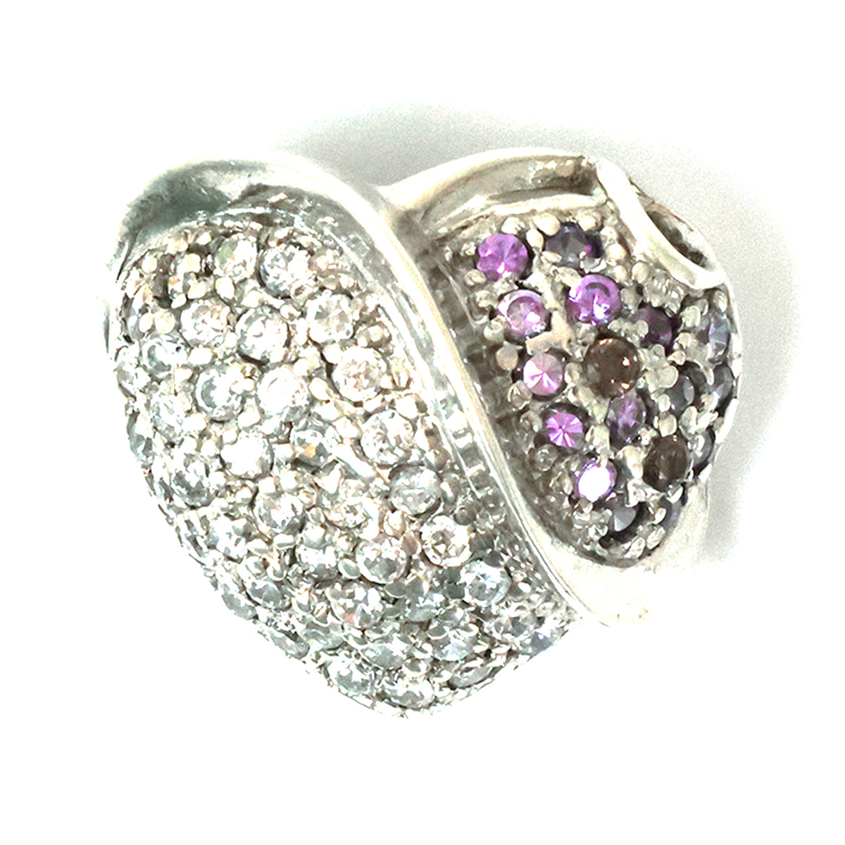 Heart-shaped silver charm with clear and purple gemstones on a white background