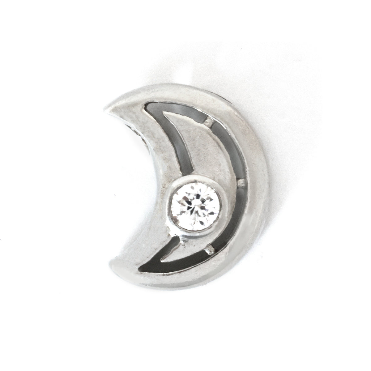 Silver crescent moon charm with a central gemstone on a white background