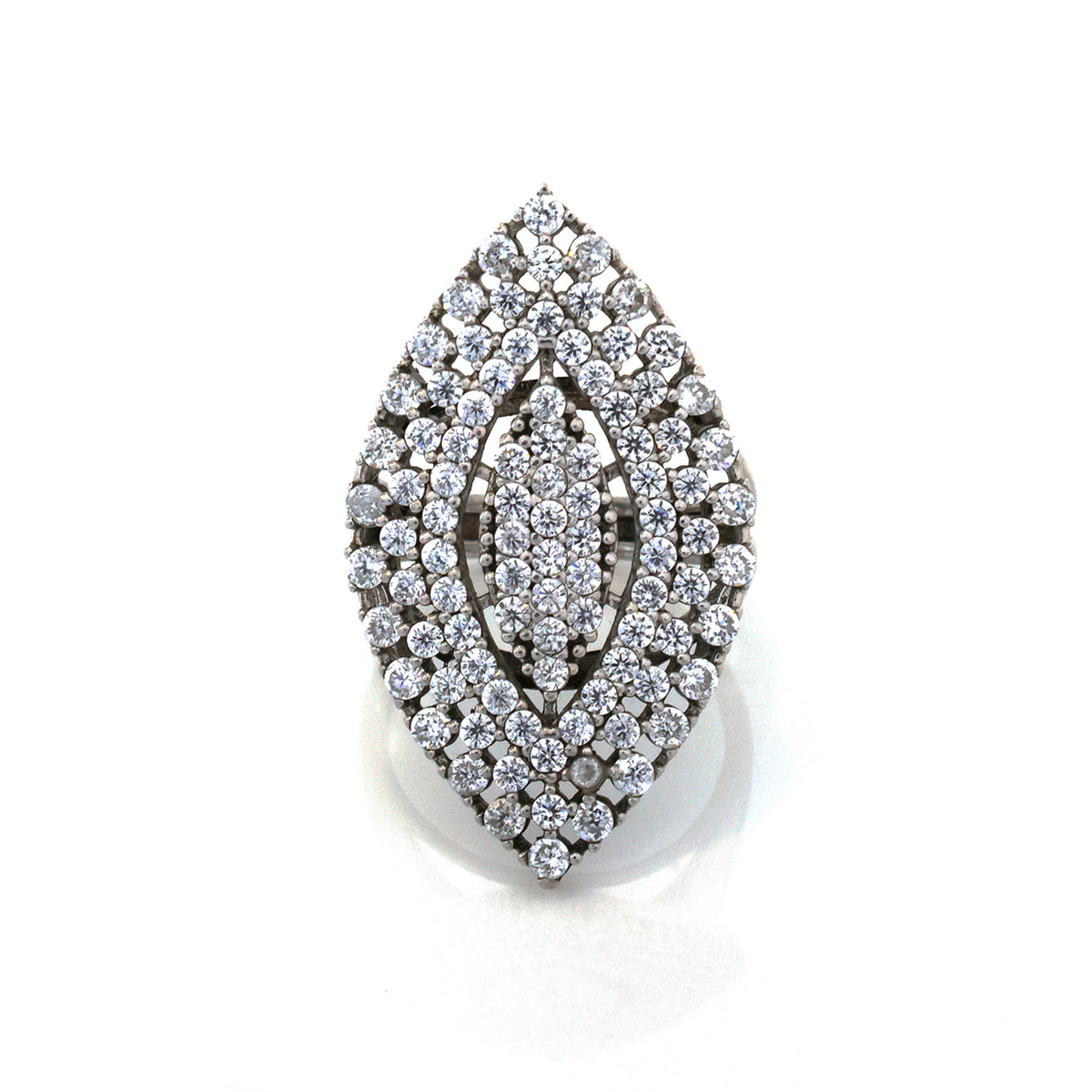 Decorative brooch with intricate design on a white background