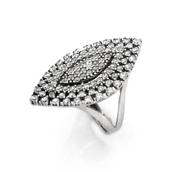 Silver ring with clear gemstones on a white background