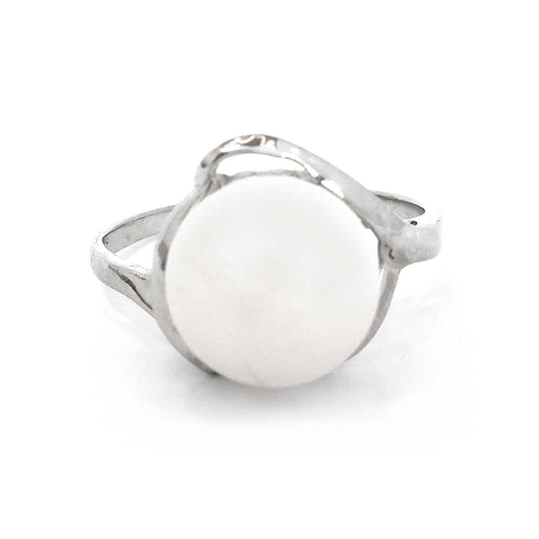Silver ring with a white circular stone on a white background