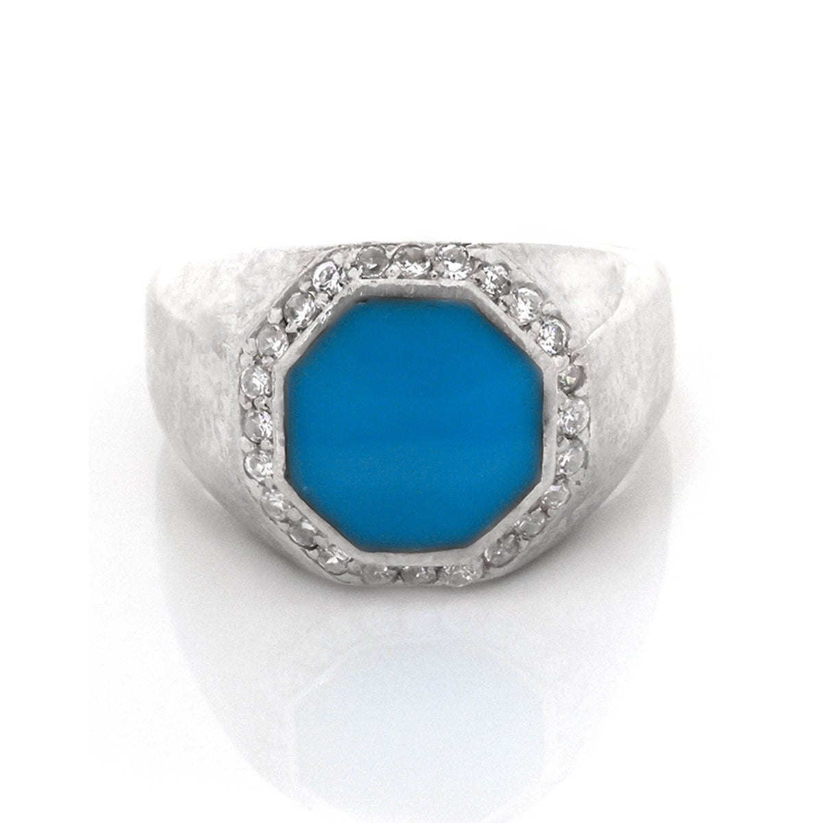 Silver ring with a blue stone on a white background
