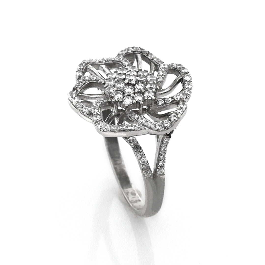 Silver ring with diamond accents on a white background