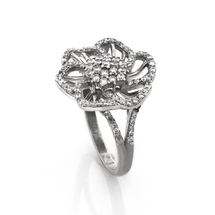 Silver ring with diamond accents on a white background