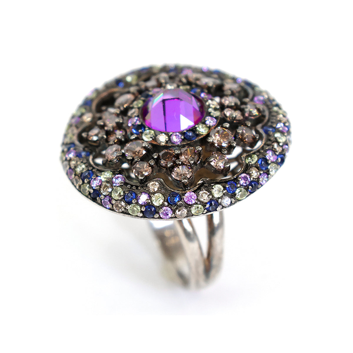 Decorative ring with purple gemstone and multicolored stones on a white background