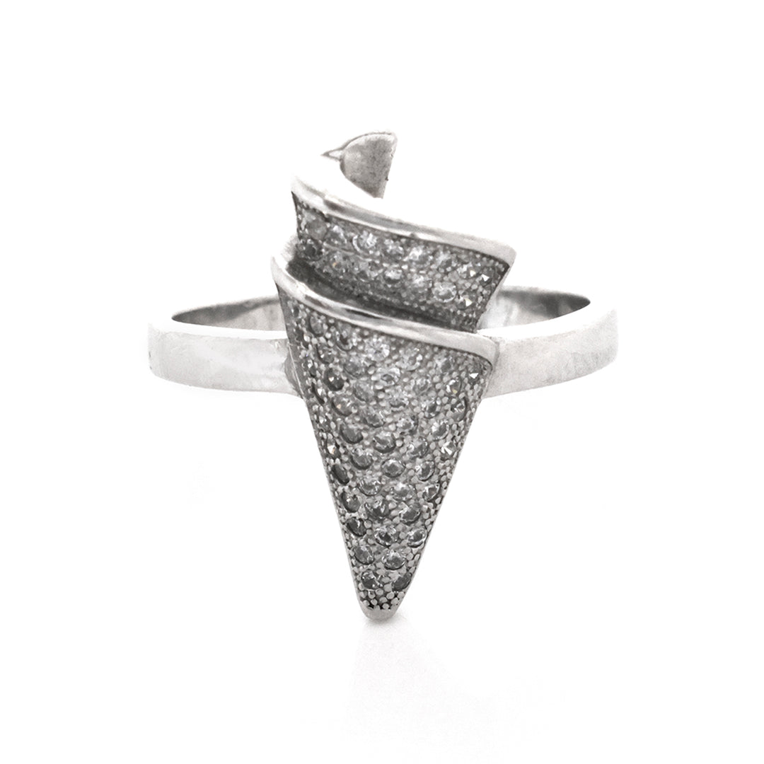 Silver ring with textured design on a white background