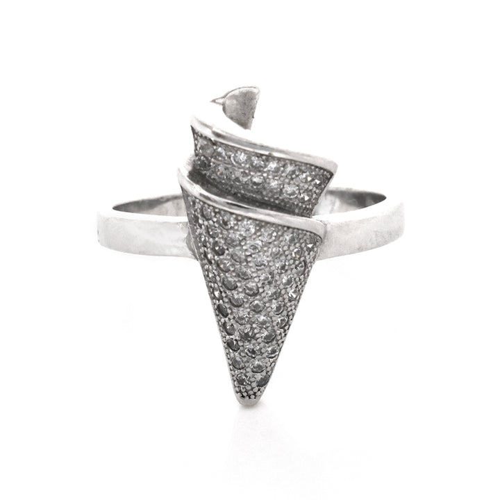 Silver ring with textured design on a white background