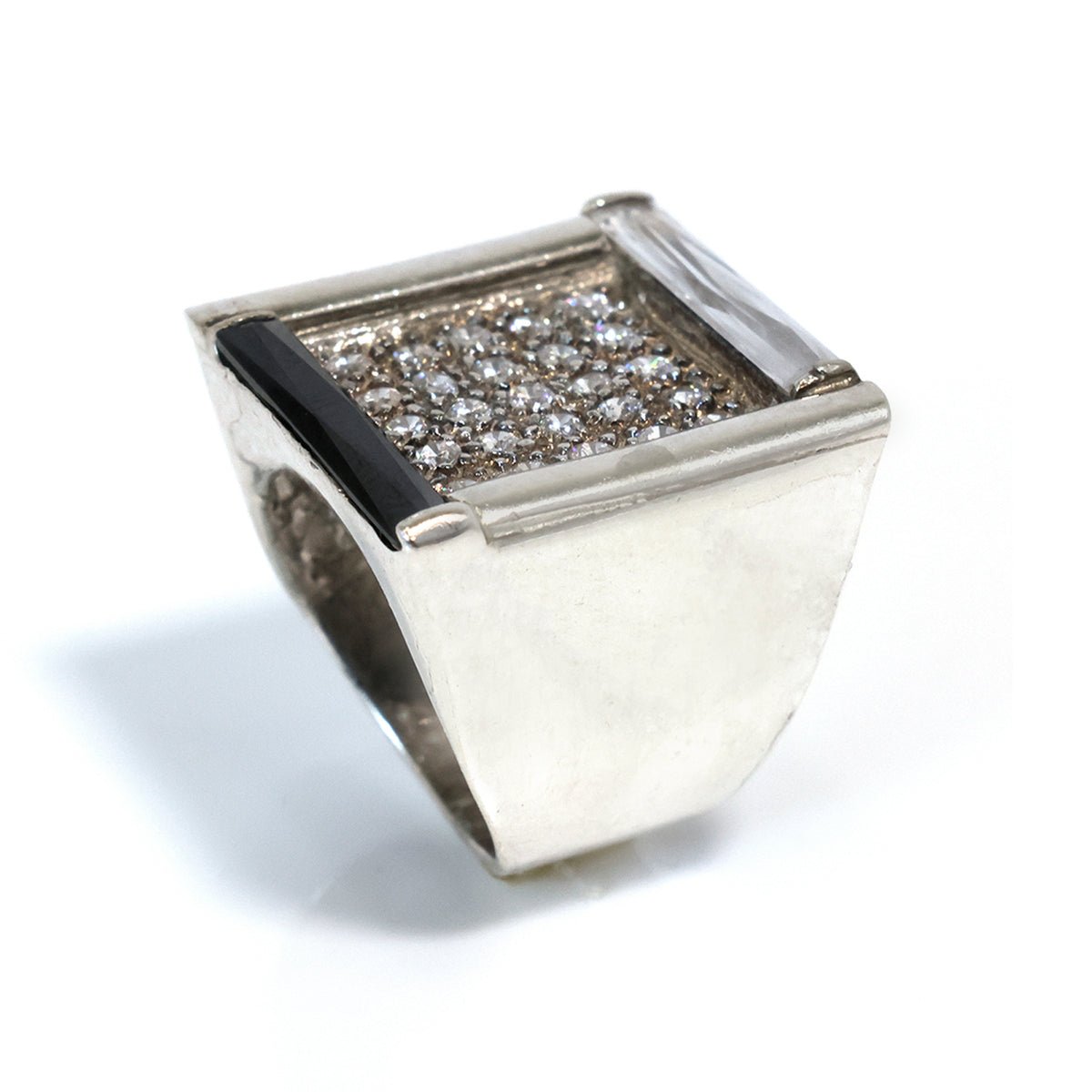 Silver ring with diamond accents on a white background