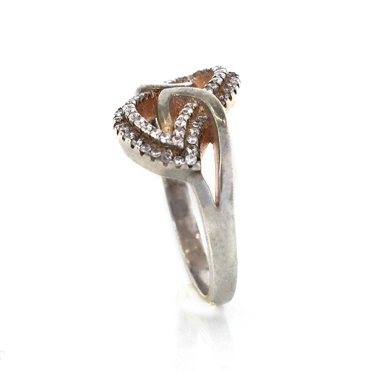 Silver ring with diamond accents on a white background