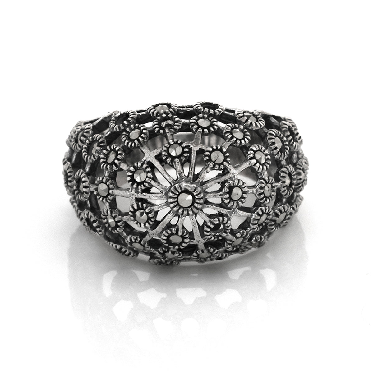 Decorative silver bowl with intricate design on a white background