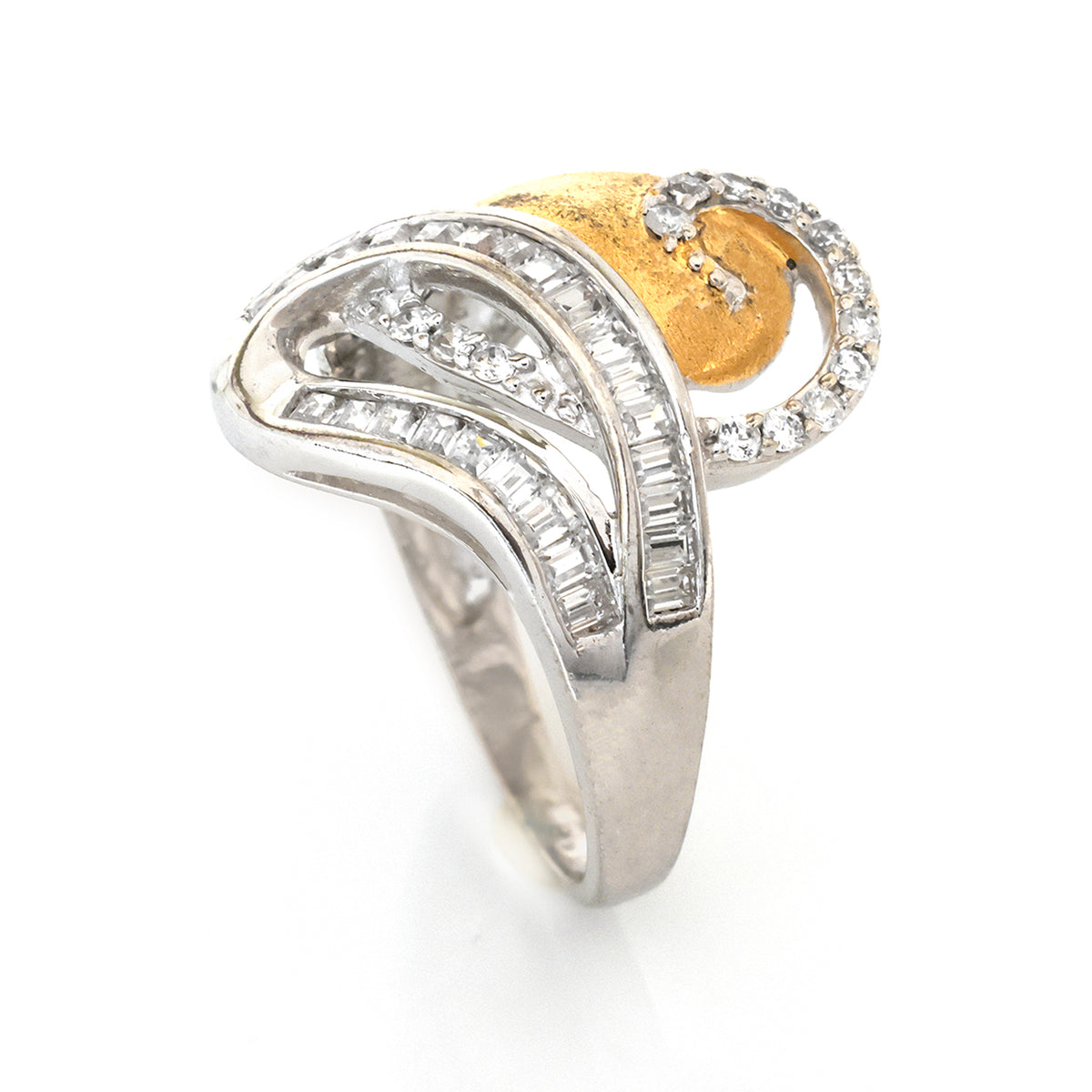 Two-tone ring with gold and silver design on a white background