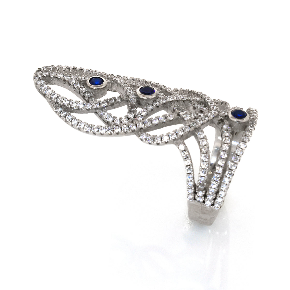 Silver ring with blue gemstones on a white background