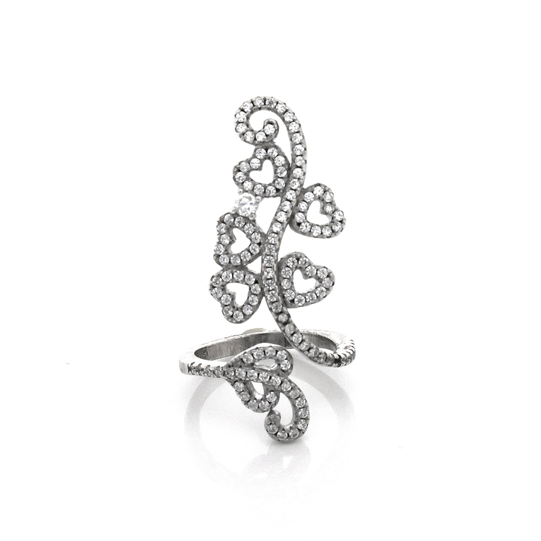 Silver ring with intricate design on a white background