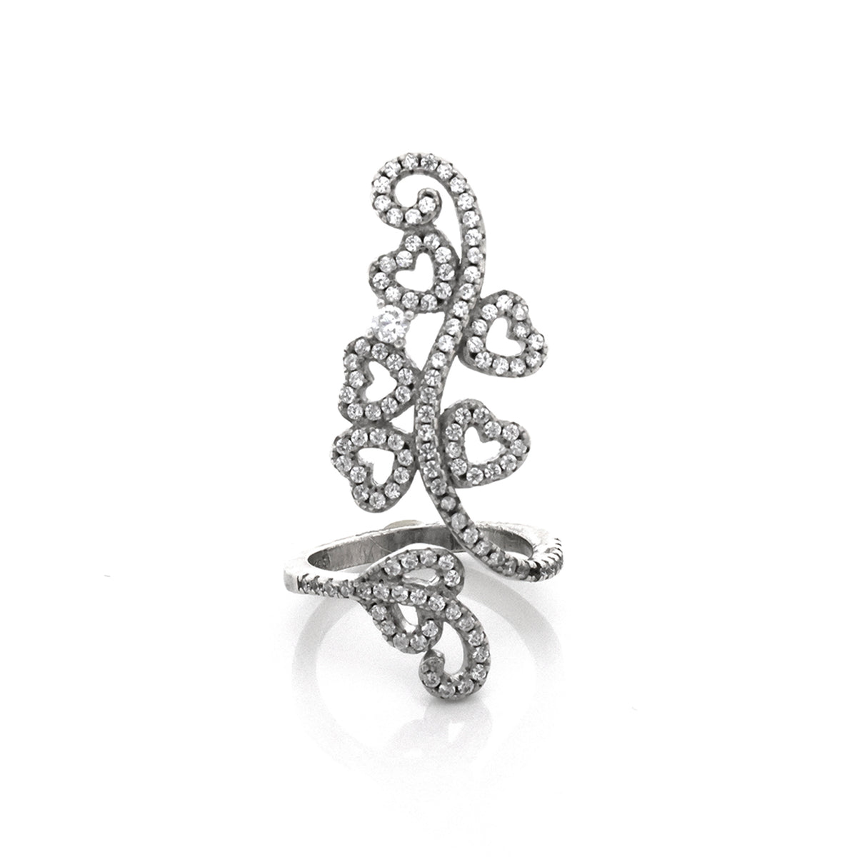 Silver ring with intricate design on a white background
