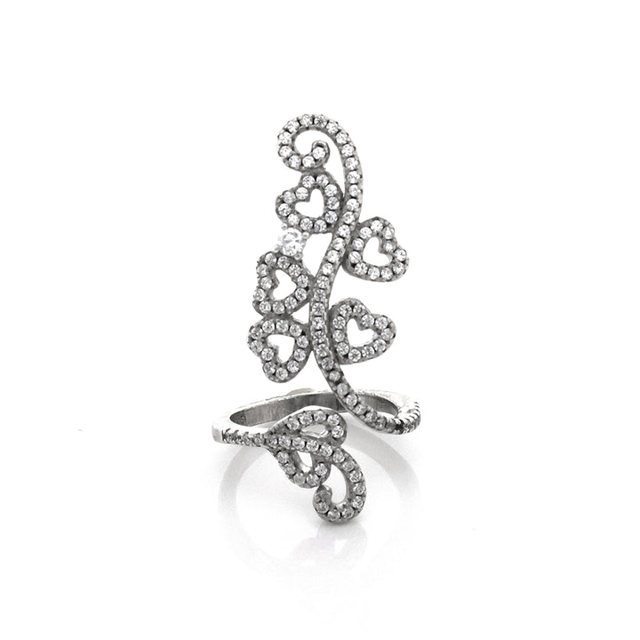 Silver ring with intricate design on a white background