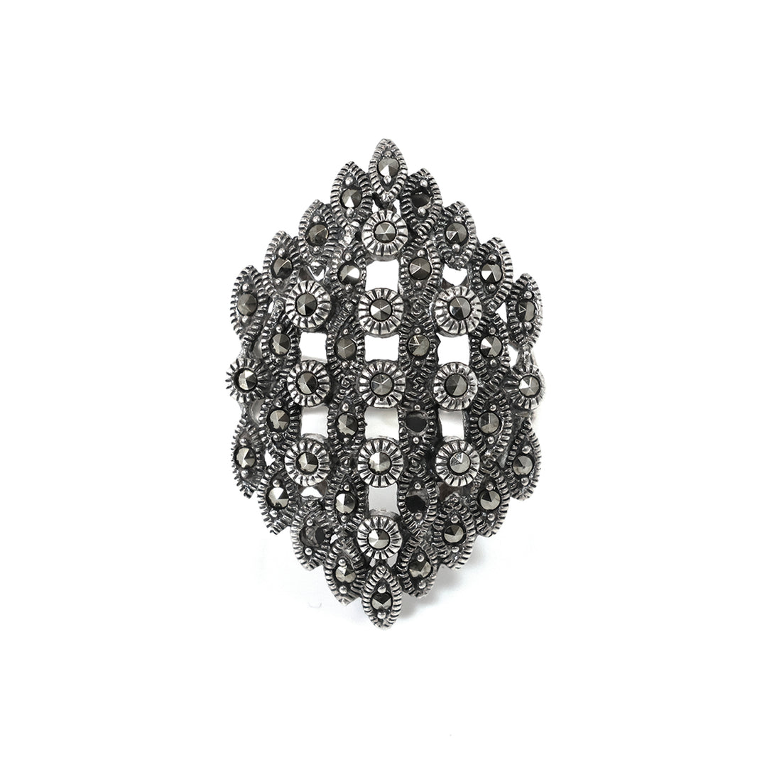 Decorative brooch with intricate design on a white background
