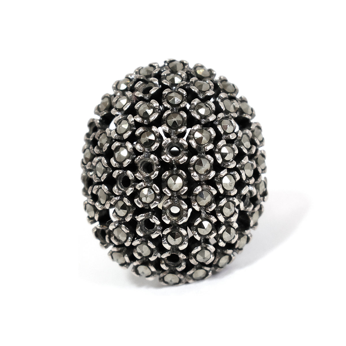 Black beaded ring on a white background
