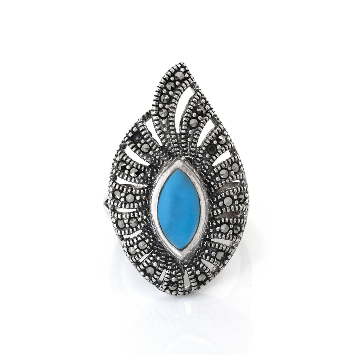 Decorative brooch with blue center and silver detailing on a white background