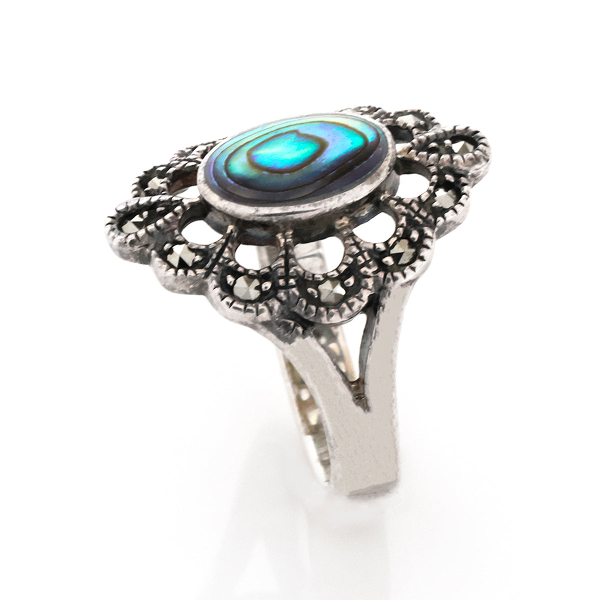 Silver ring with a blue gemstone on a white background