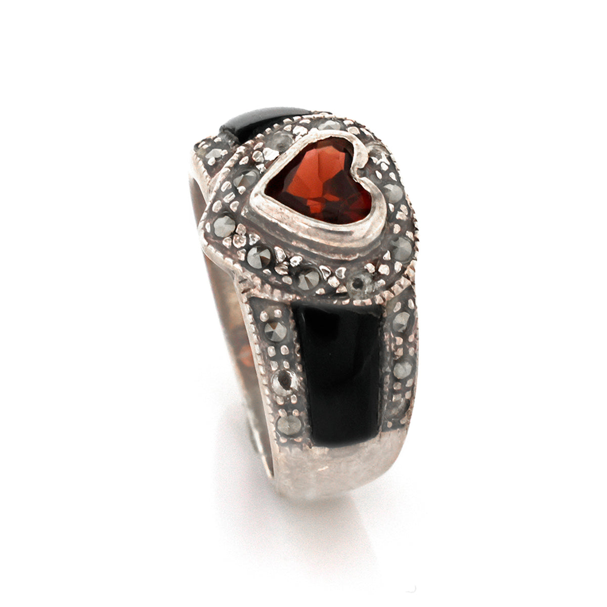 Silver ring with heart-shaped gemstone on a white background