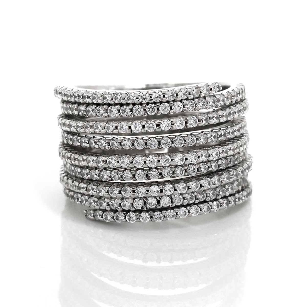 Stack of silver bracelets with clear stones on a white background
