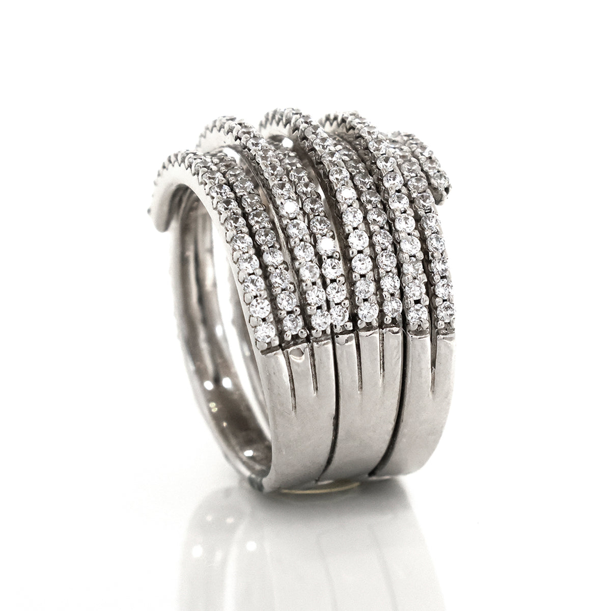 Silver ring with multiple rows of diamonds on a white background