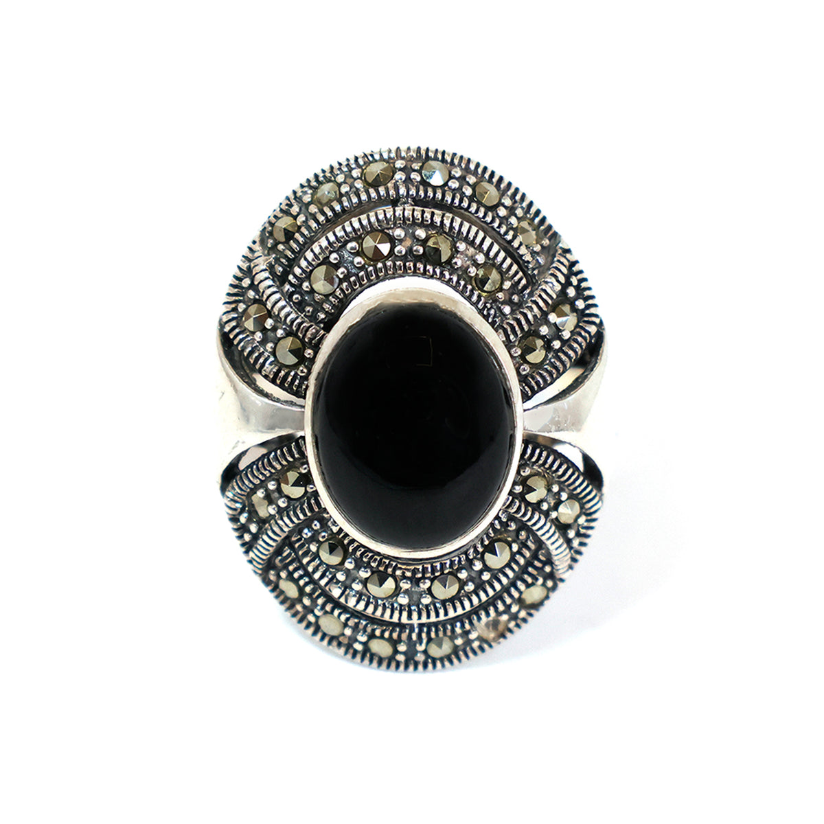 Silver ring with black gemstone on a white background
