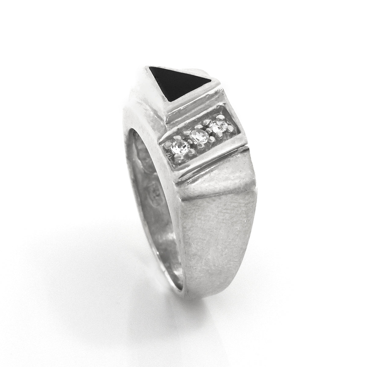 Silver ring with black gemstone and clear stones on a white background