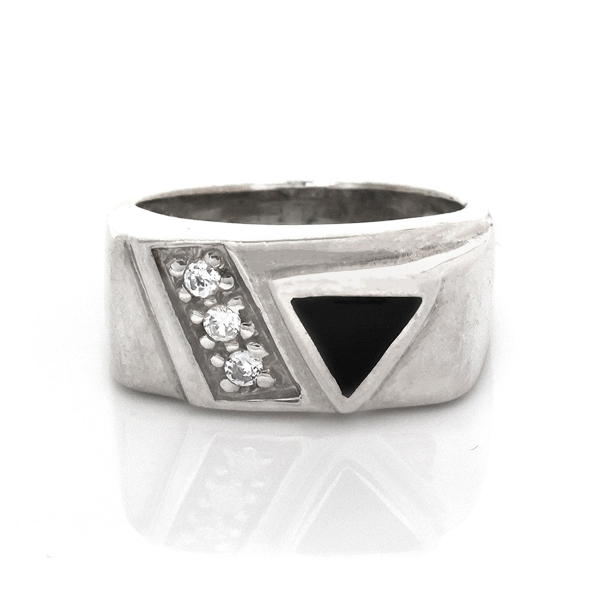 Silver ring with black triangle and clear stones on a white background