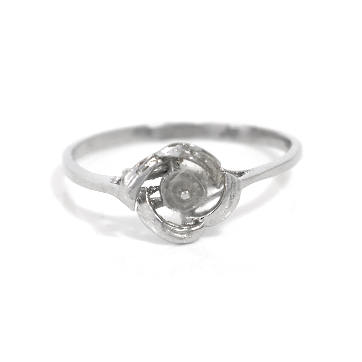 Silver ring with a diamond on a white background
