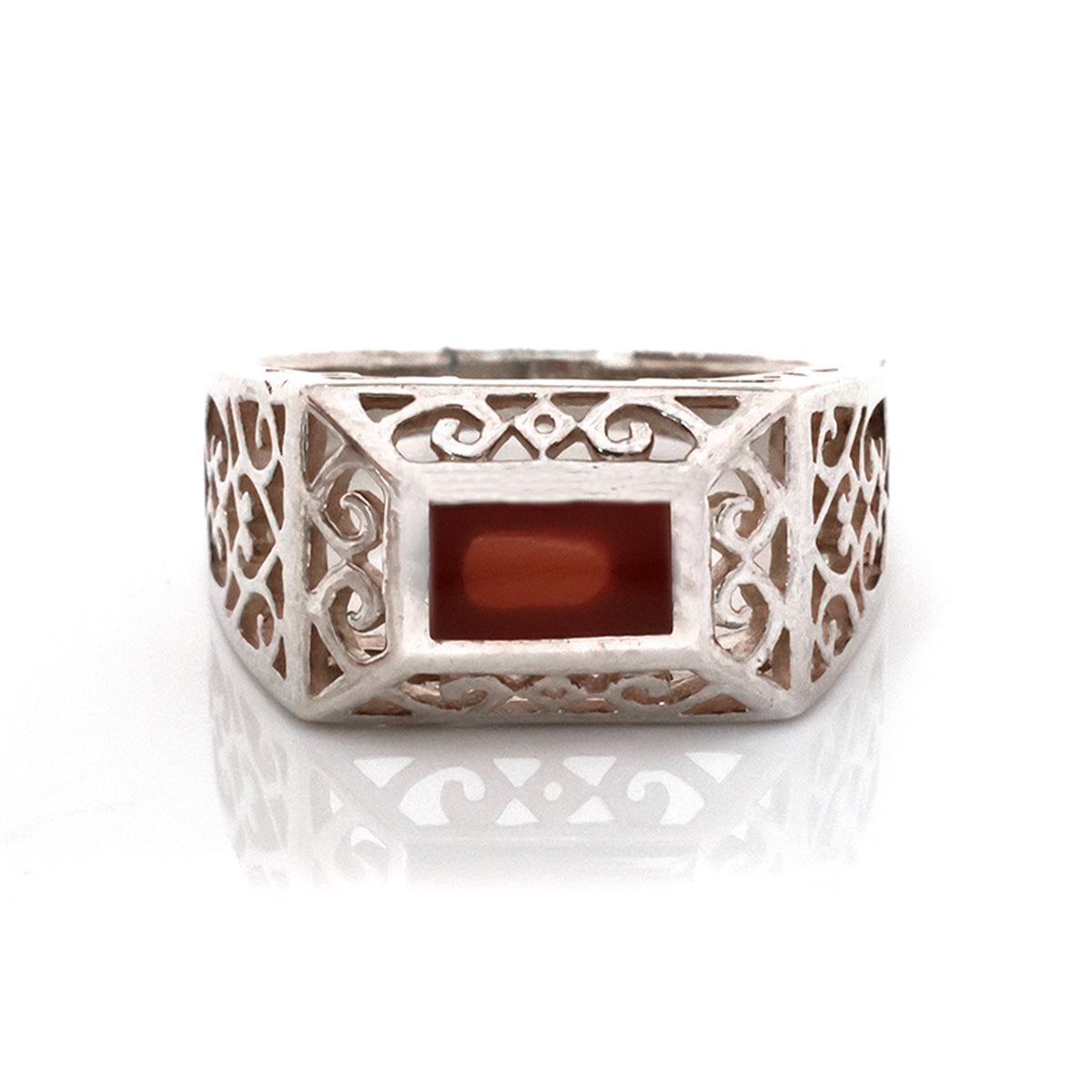 Silver ring with a rectangular stone on a white background