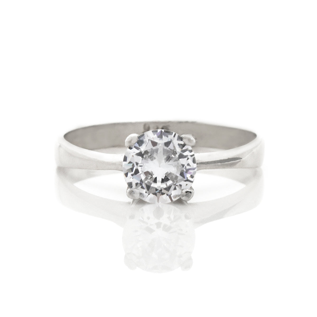 Silver ring with a diamond on a white background