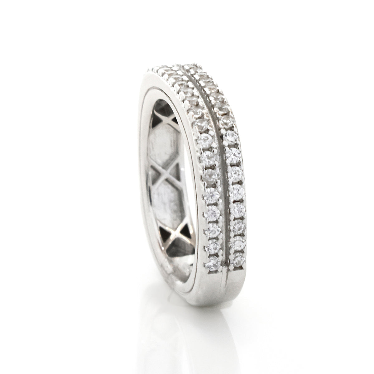 Silver ring with diamond accents on a white background